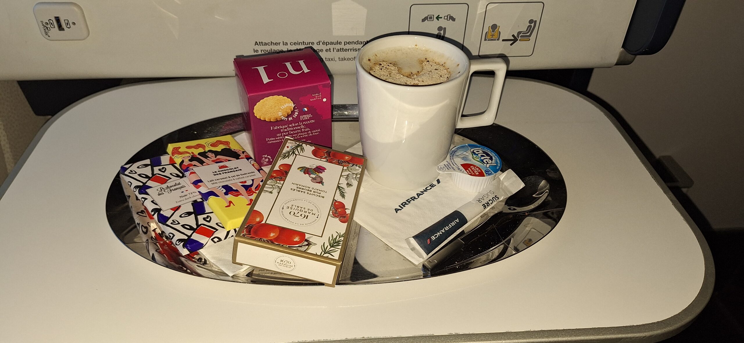 a coffee cup and other items on a tray