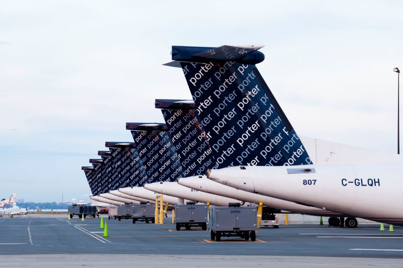 a row of airplanes parked on a tarmac