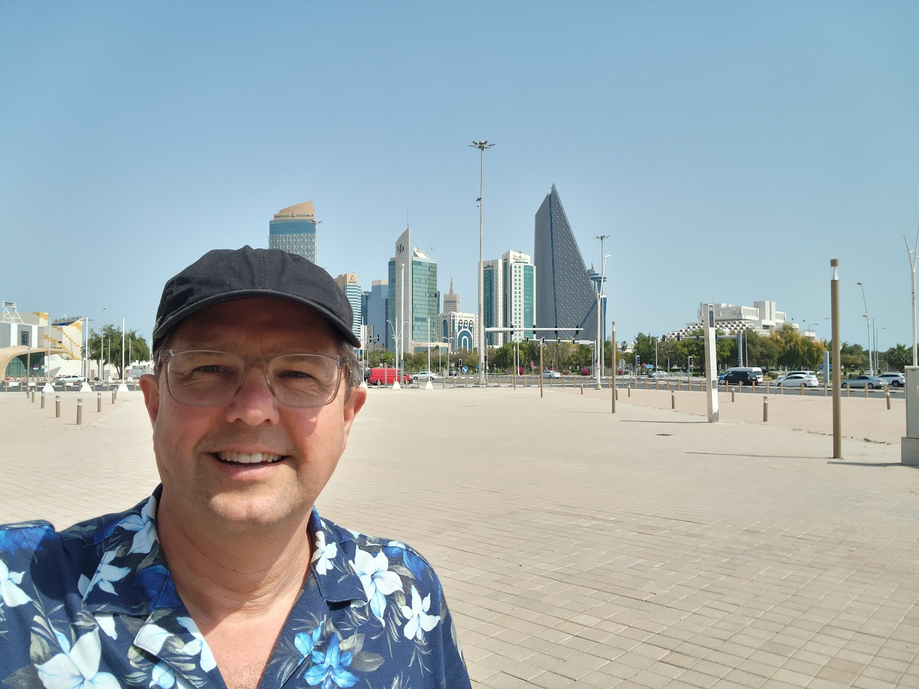 a man taking a selfie in front of a city
