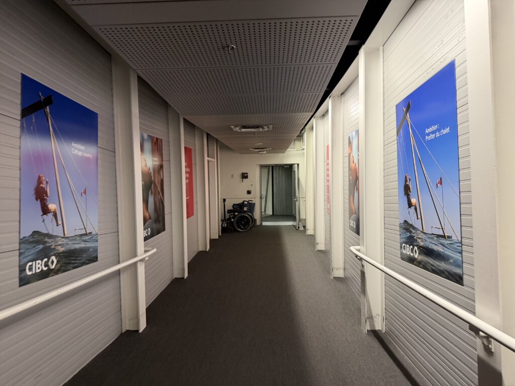 a hallway with posters on the wall