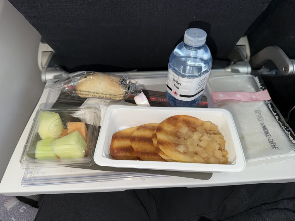 food on a tray on a plane