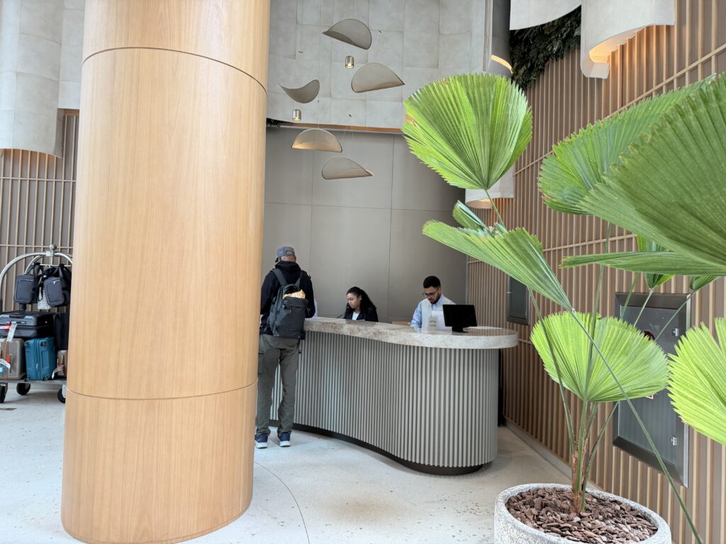 people standing at a reception desk