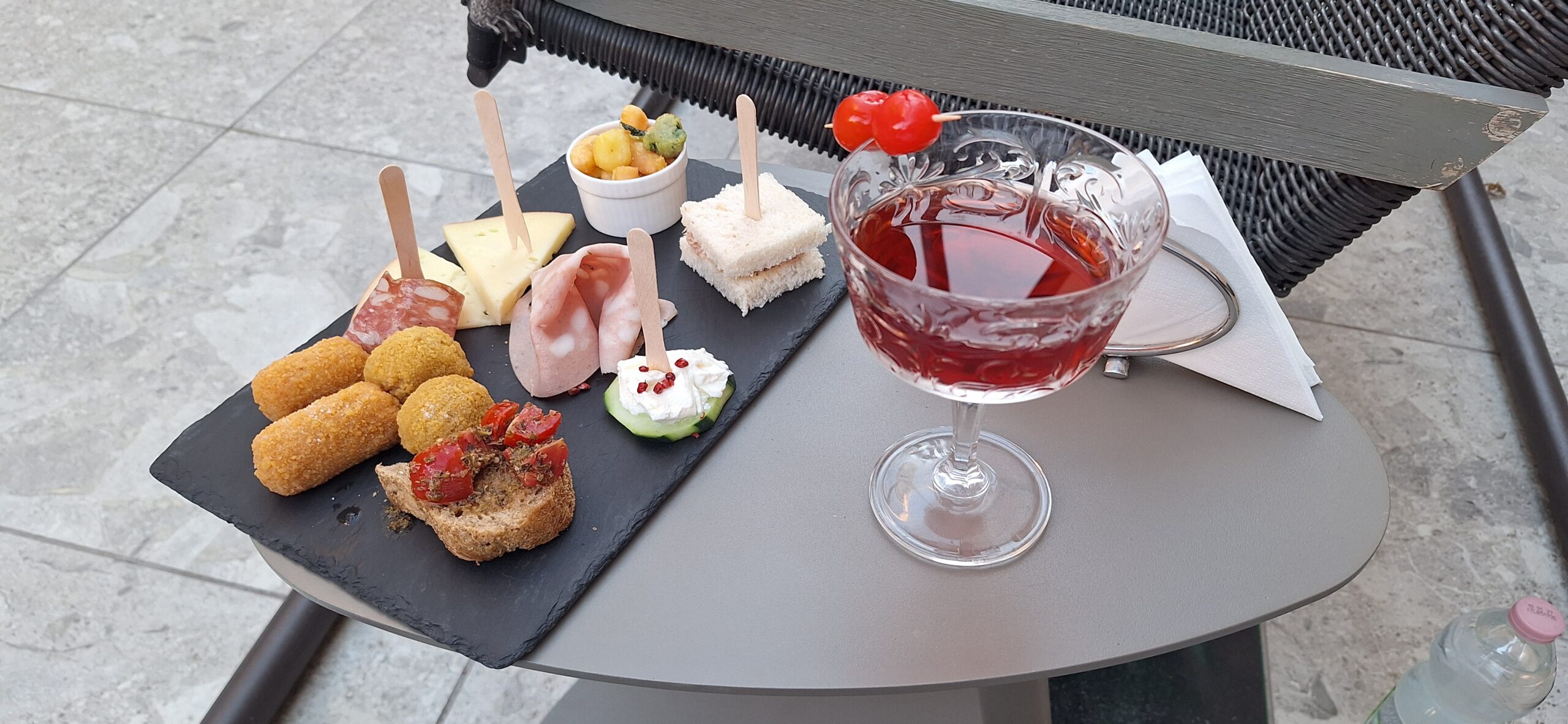 a plate of food and a drink on a table