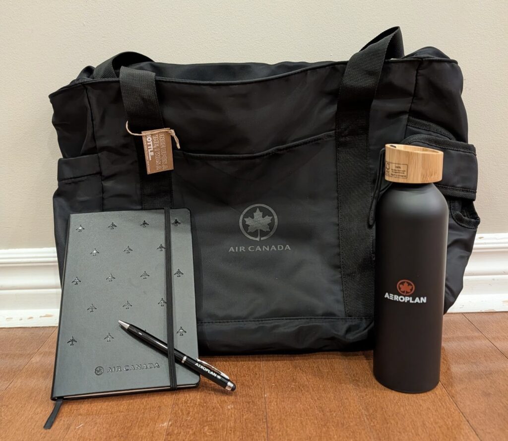 a black bag with a pen and a notebook