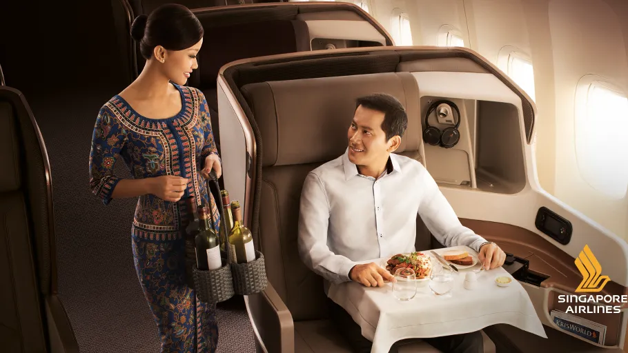 a woman serving a man in a chair