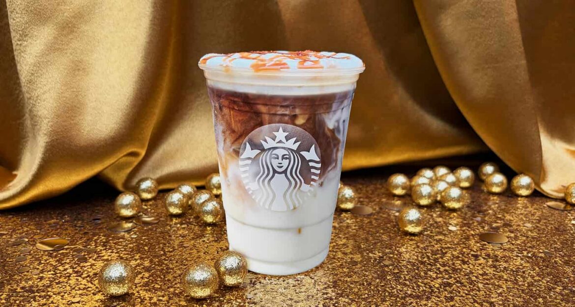 a cup of coffee with a caramel topping