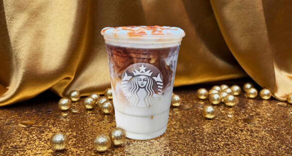 a cup of coffee with a caramel topping