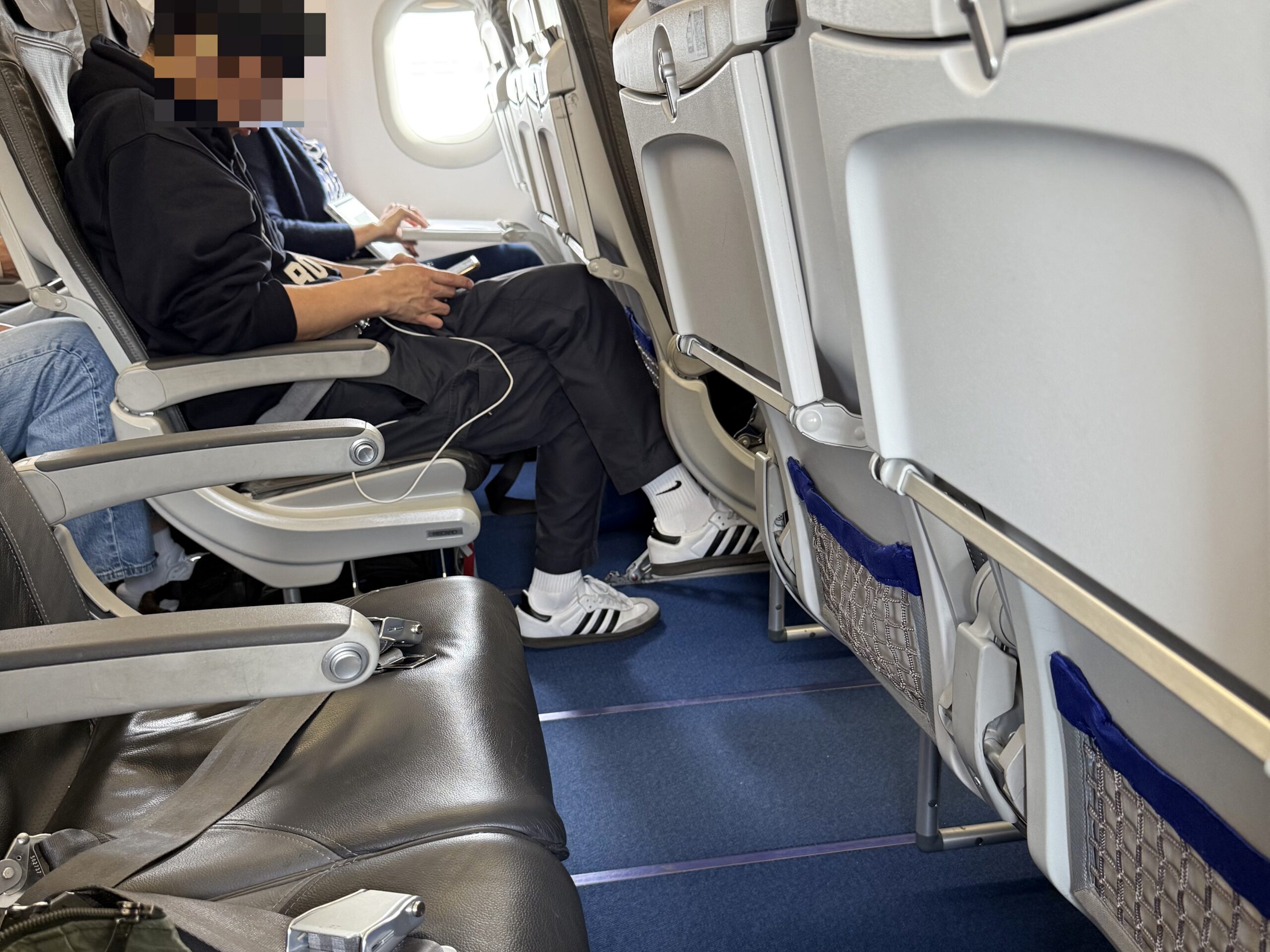 a man sitting on an airplane