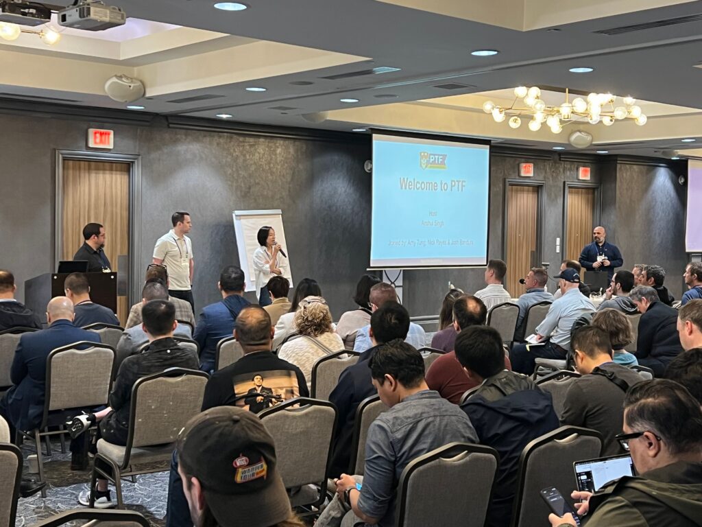 a group of people in a room with a projection screen