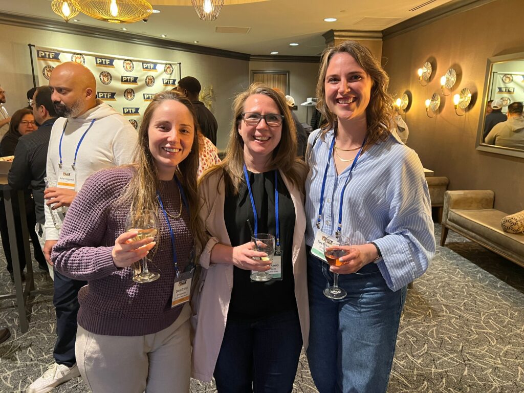 a group of women holding wine glasses