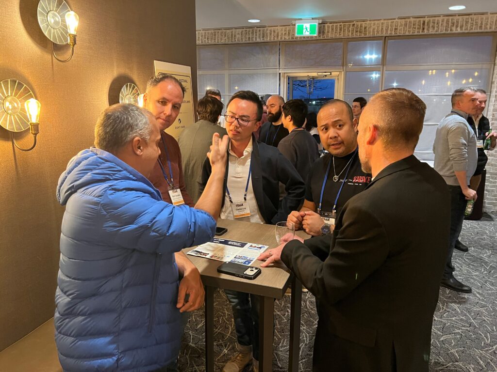a group of men standing around a table