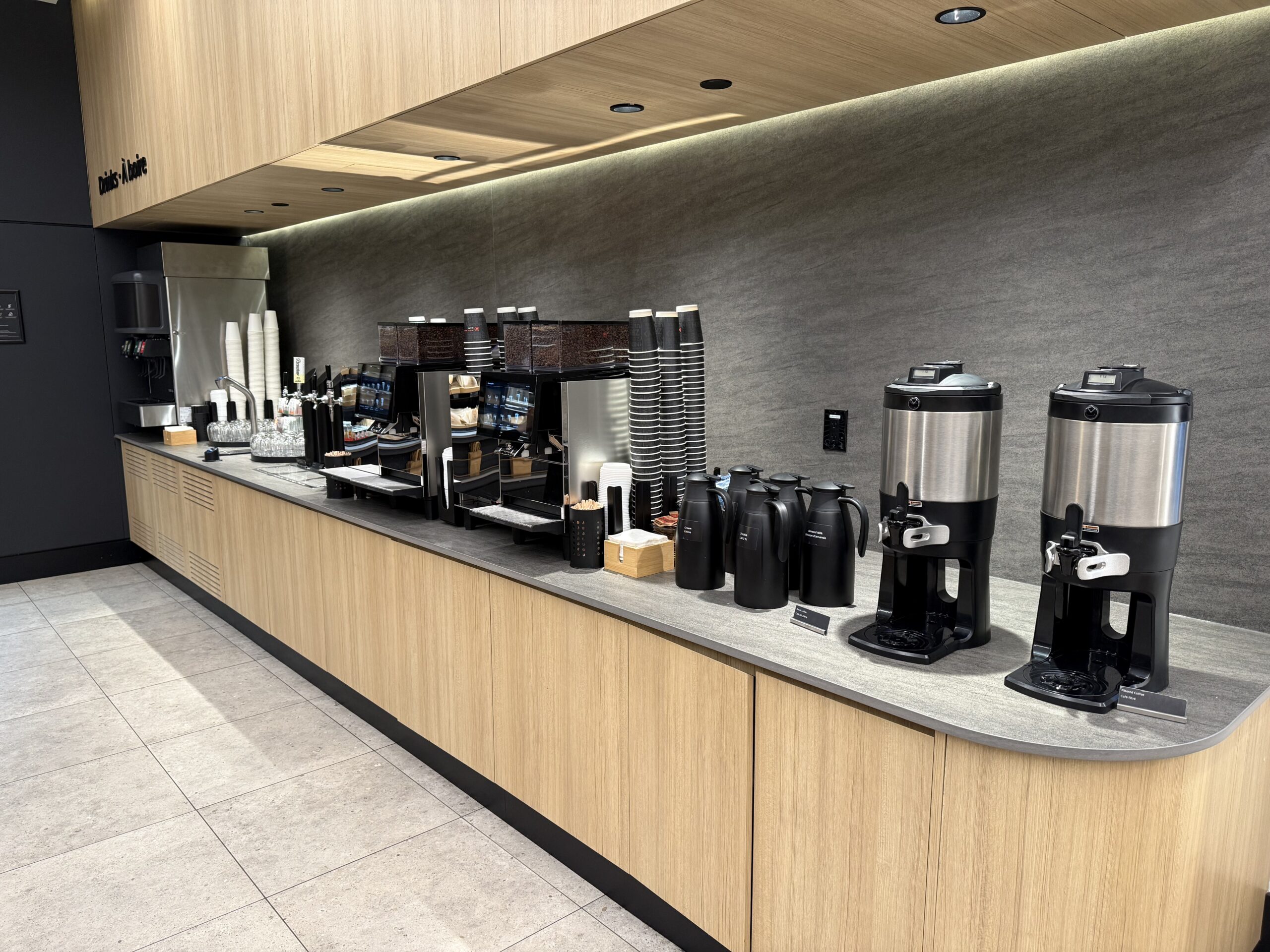 Air Canada Cafe YVR C47 a counter with coffee machines and containers