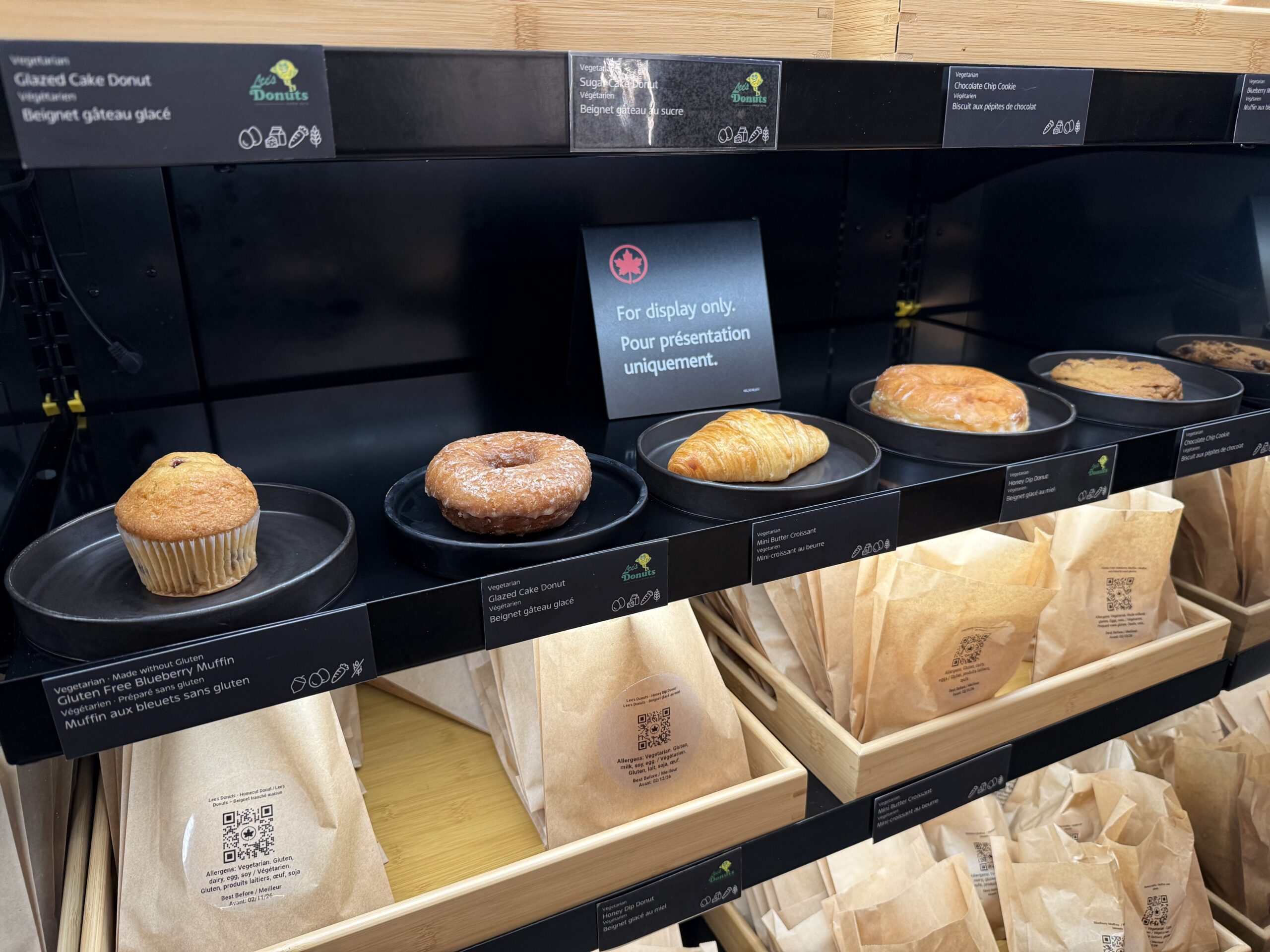 Air Canada Cafe YVR C47 a shelf with pastries and bags on it