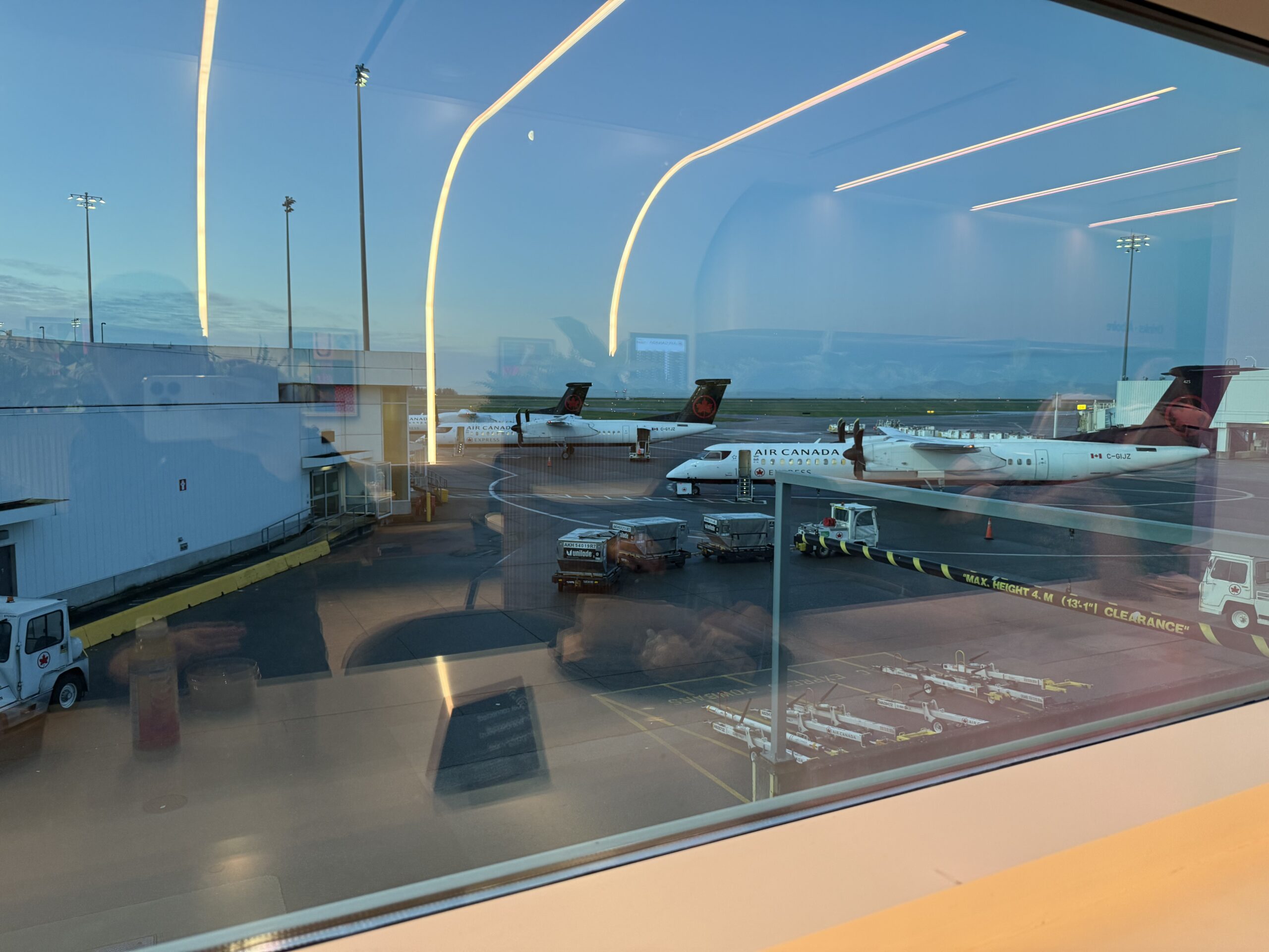 Air Canada Cafe YVR C47 a view of airplanes at an airport