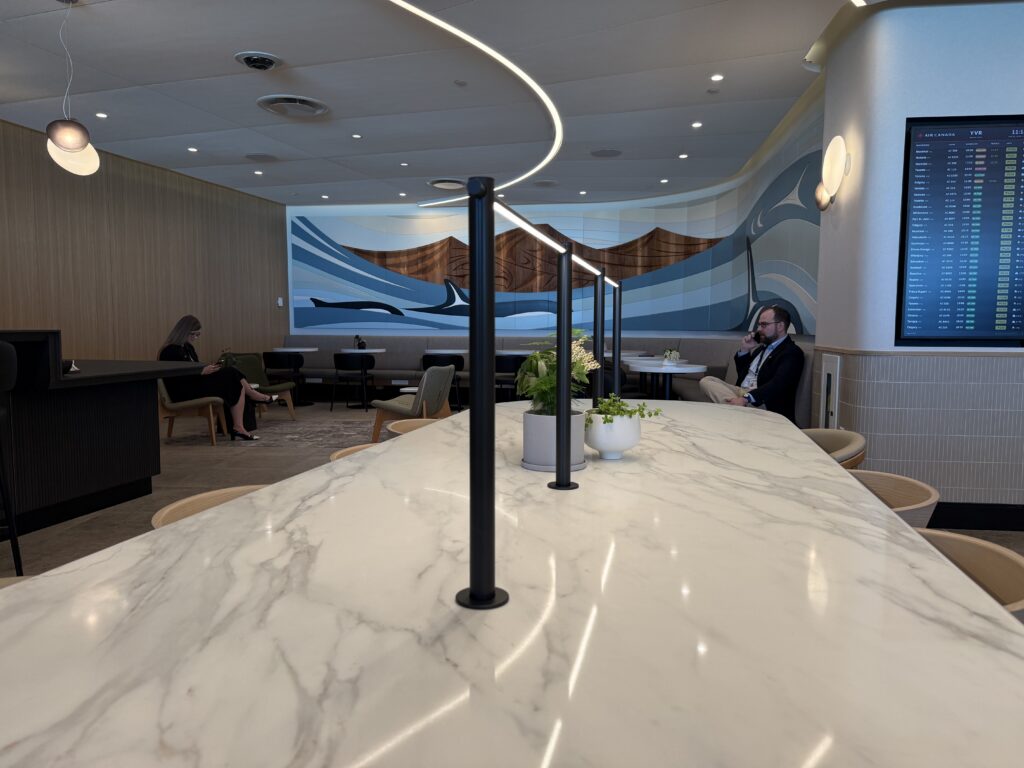 Air Canada Cafe YVR C50 a man on the phone