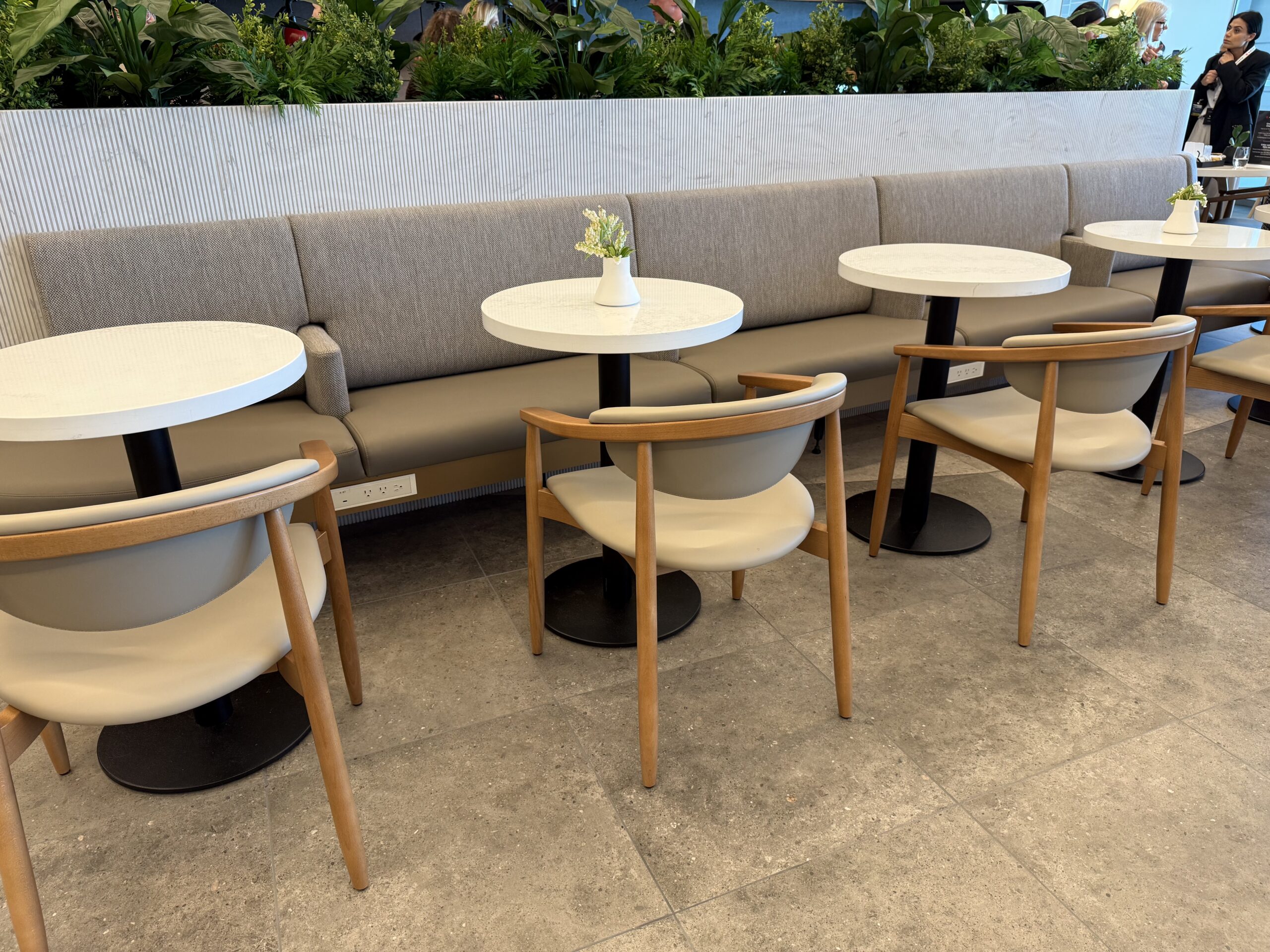 Air Canada Cafe YVR C50 a group of tables and chairs in a room