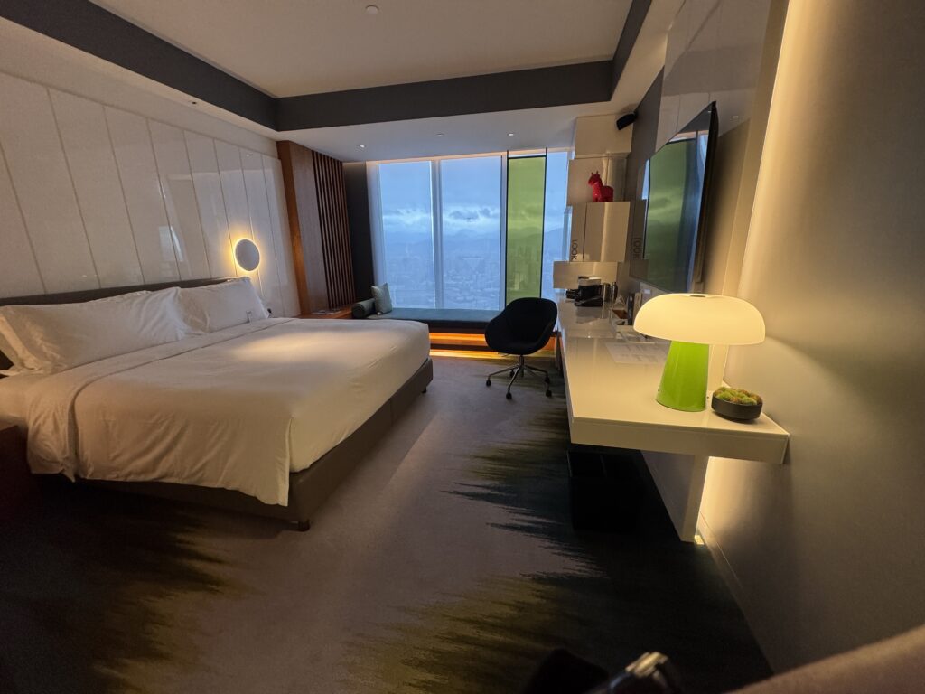 a room with a bed and a desk