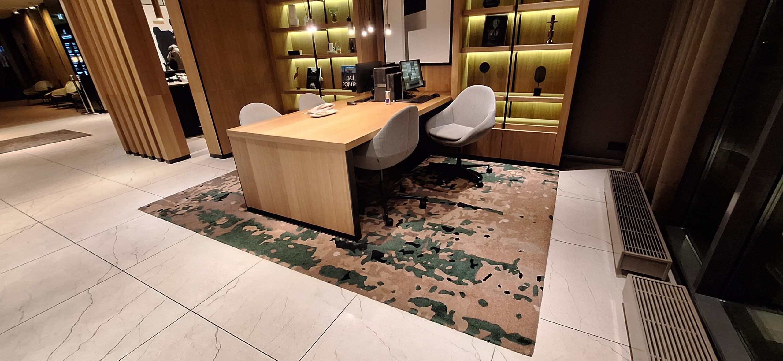 AC Hotel Riga by Marriott Review a desk with chairs and a computer on it