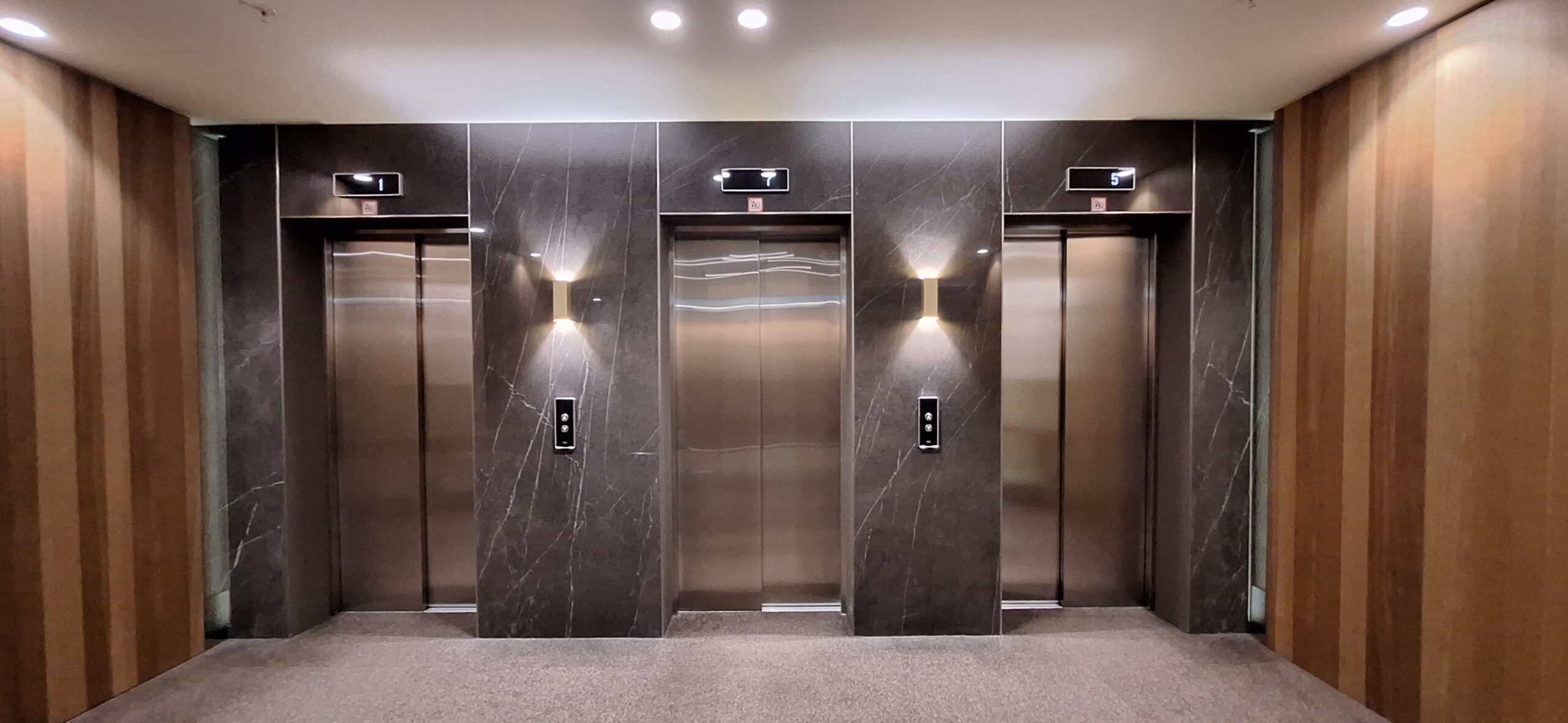 AC Hotel Riga by Marriott Review a group of elevators with lights on
