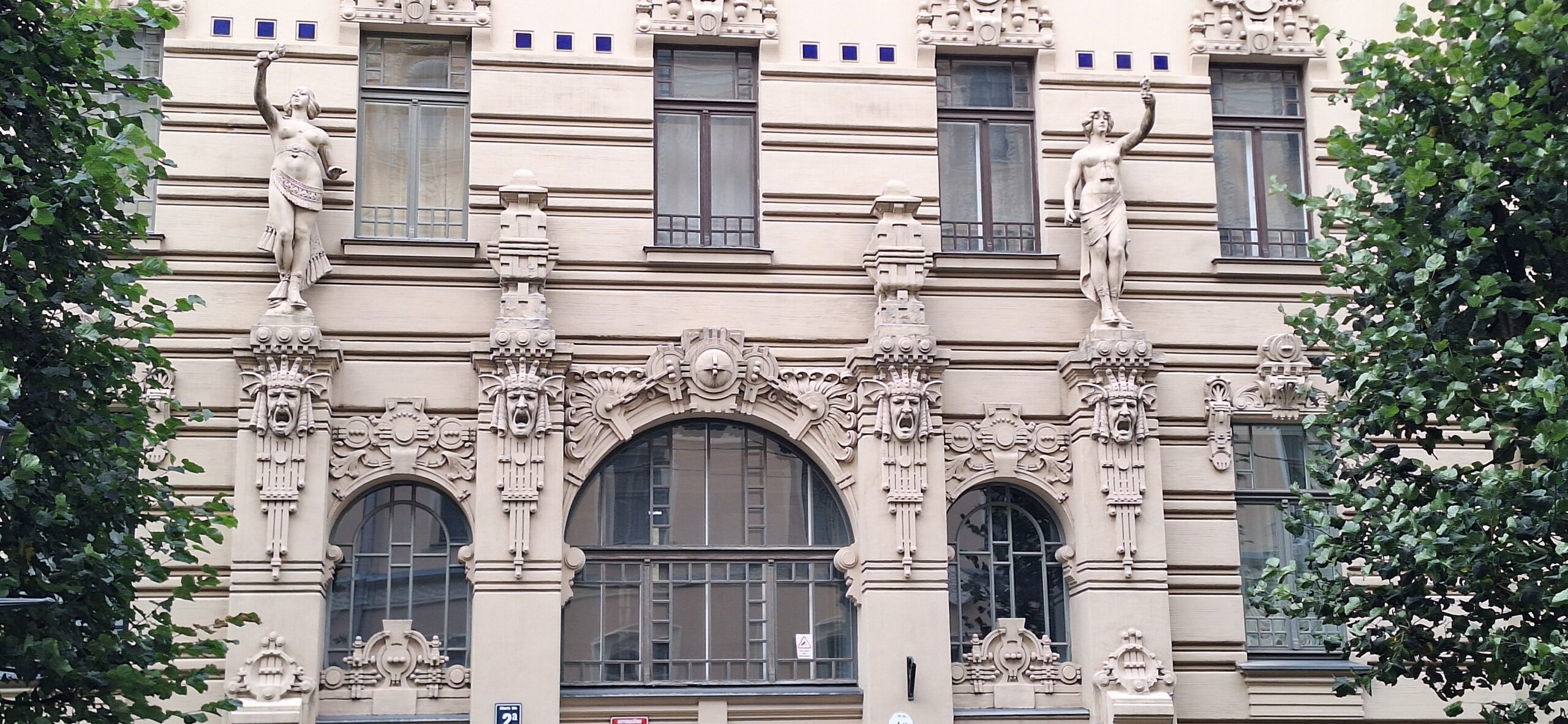a building with statues on the side