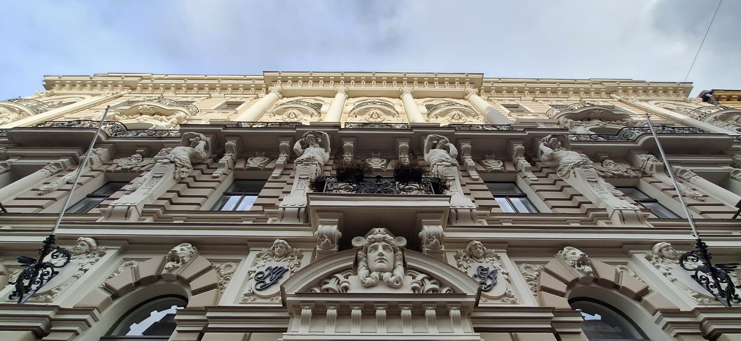 AC Hotel Riga by Marriott Review a building with statues on the front