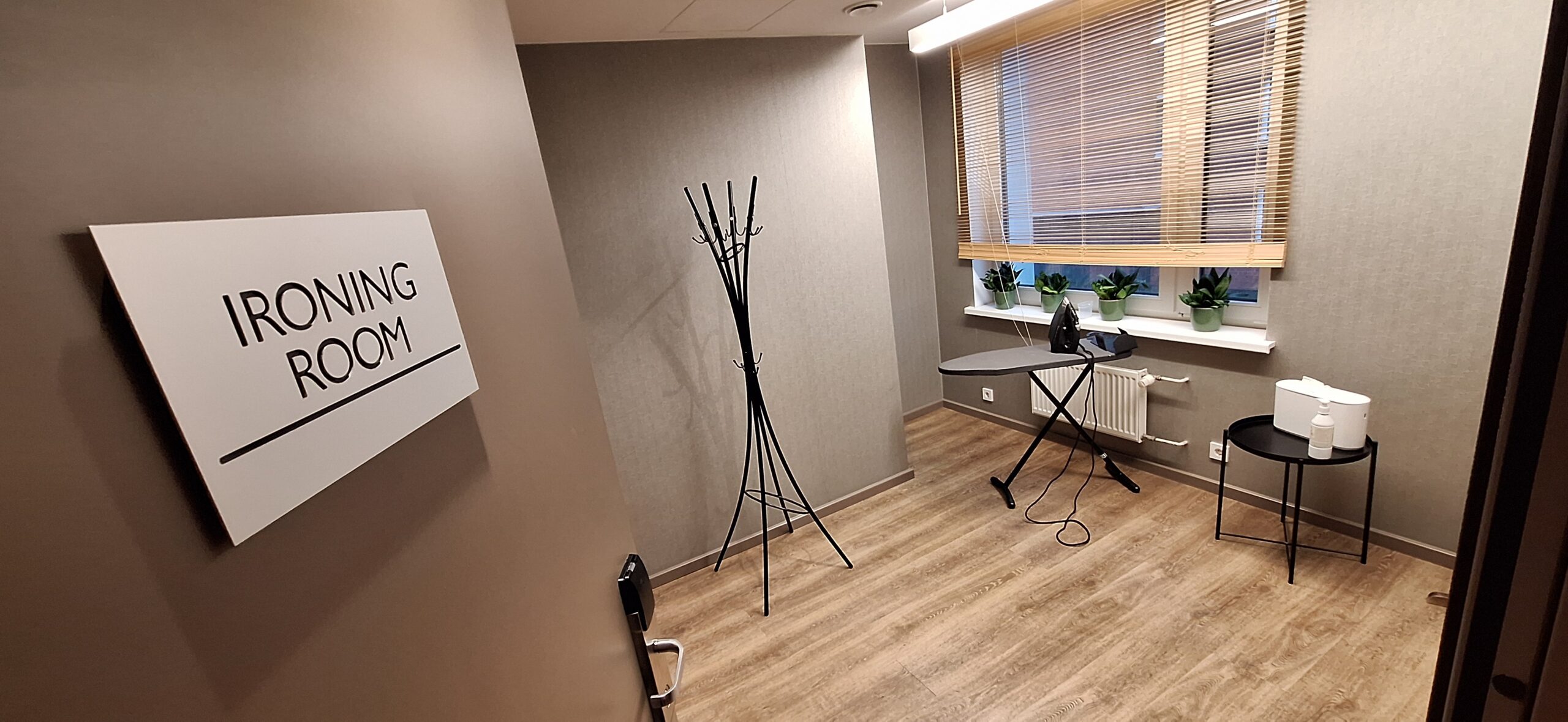 AC Hotel Riga by Marriott Review a room with a wood floor and a stand