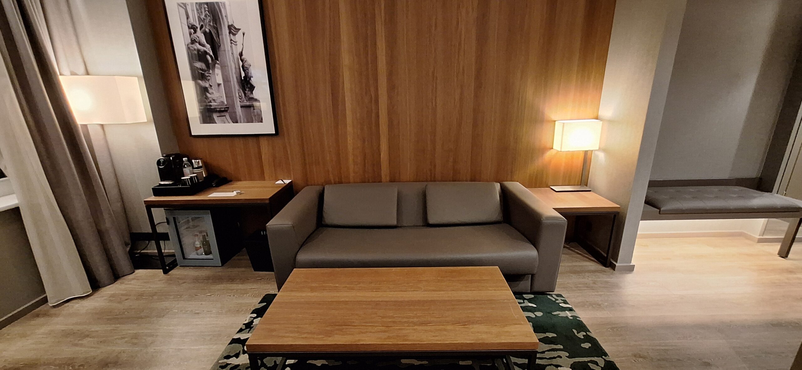 AC Hotel Riga by Marriott Review a couch and coffee tables in a room