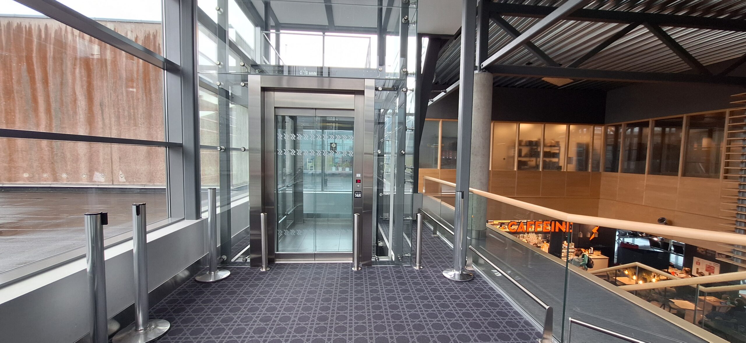 an elevator with glass doors