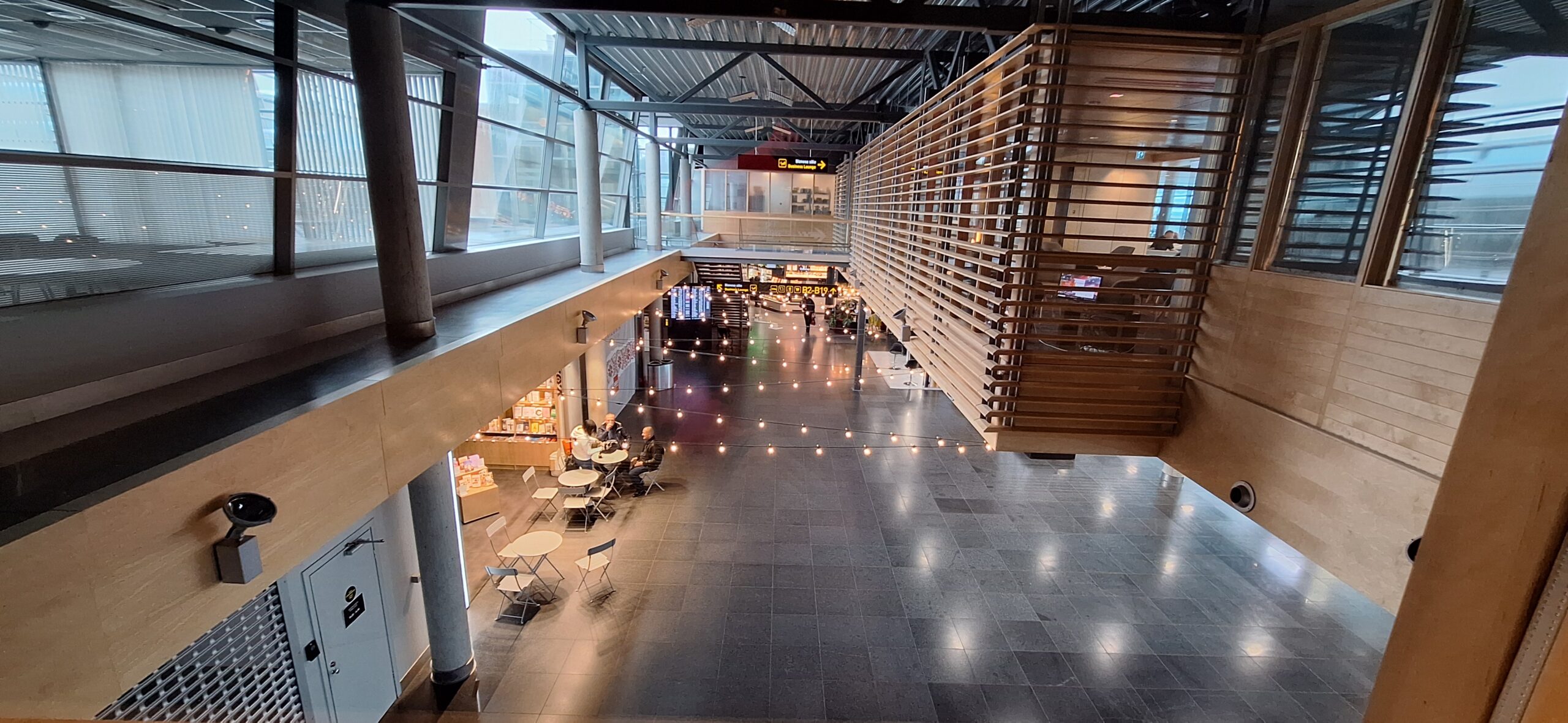 a large building with tables and chairs