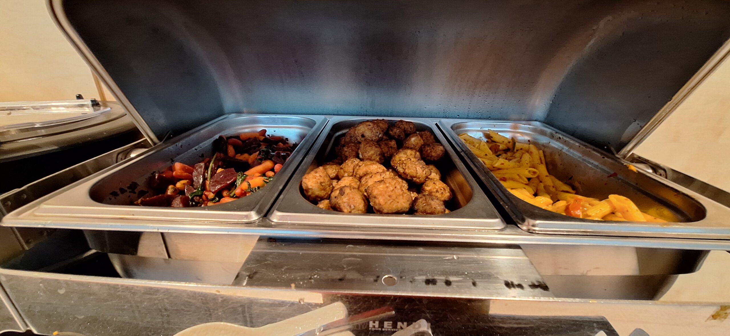 a trays of food in a buffet