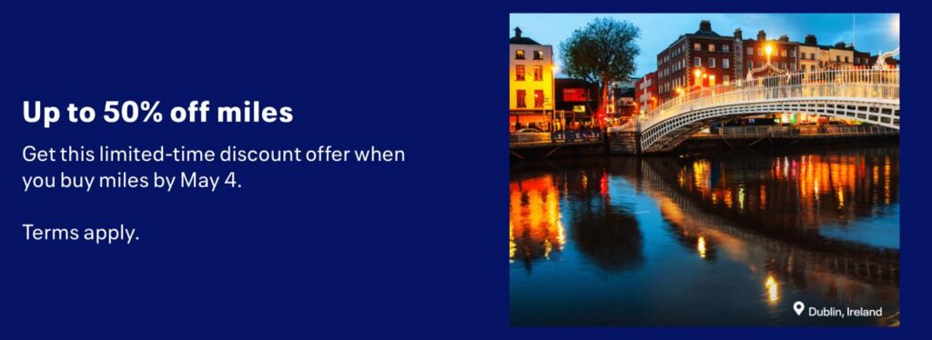 a water body with buildings and a bridge