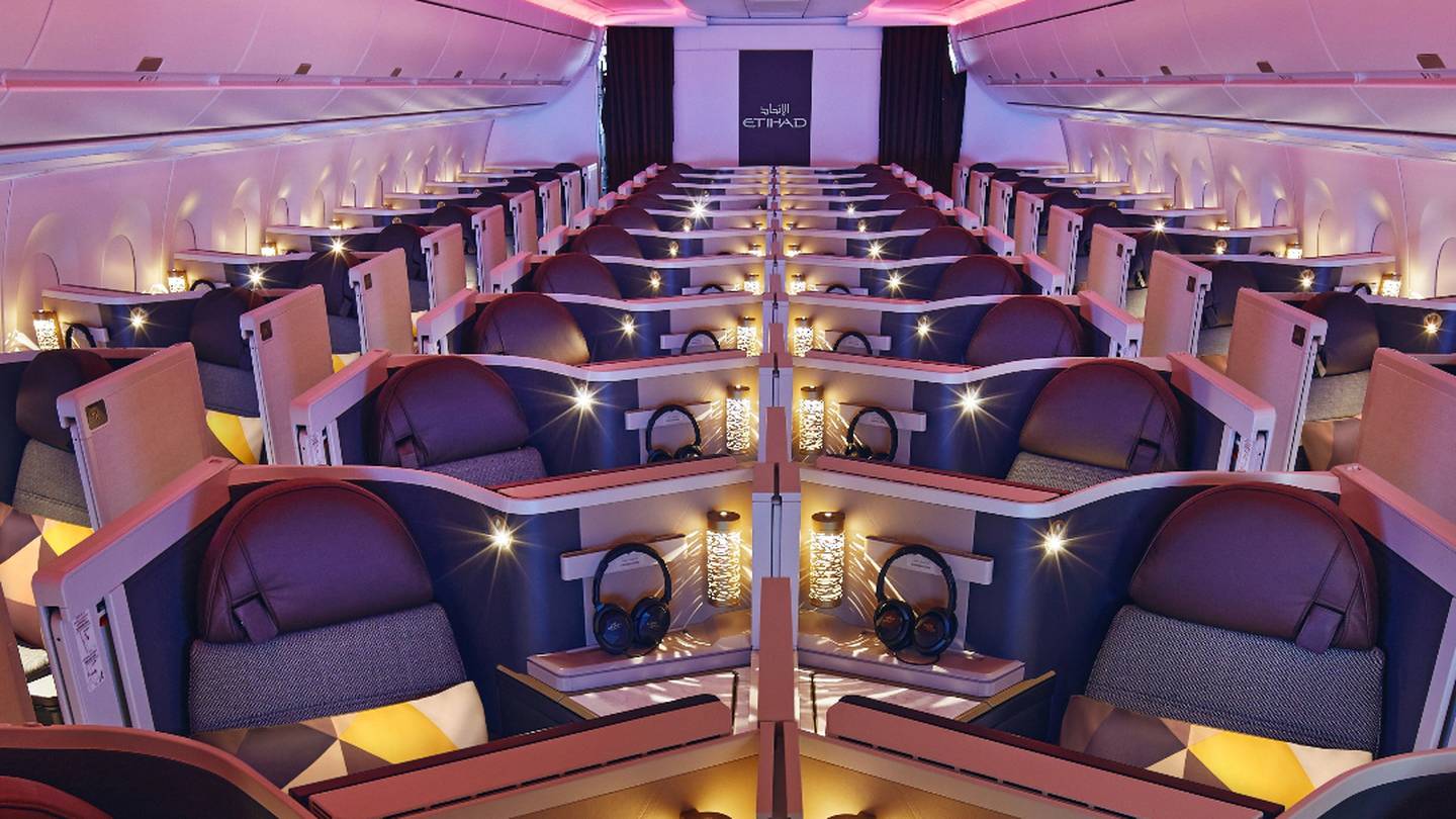 a room with rows of seats and headphones