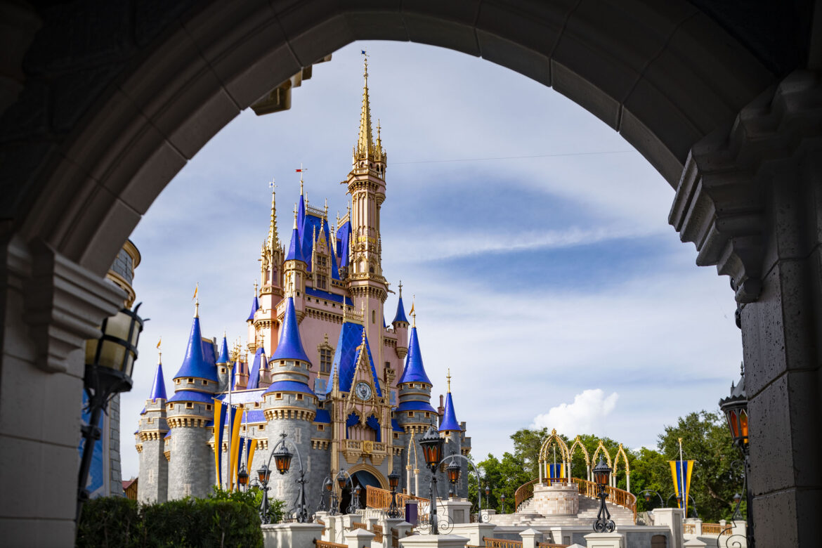a castle with blue and gold towers