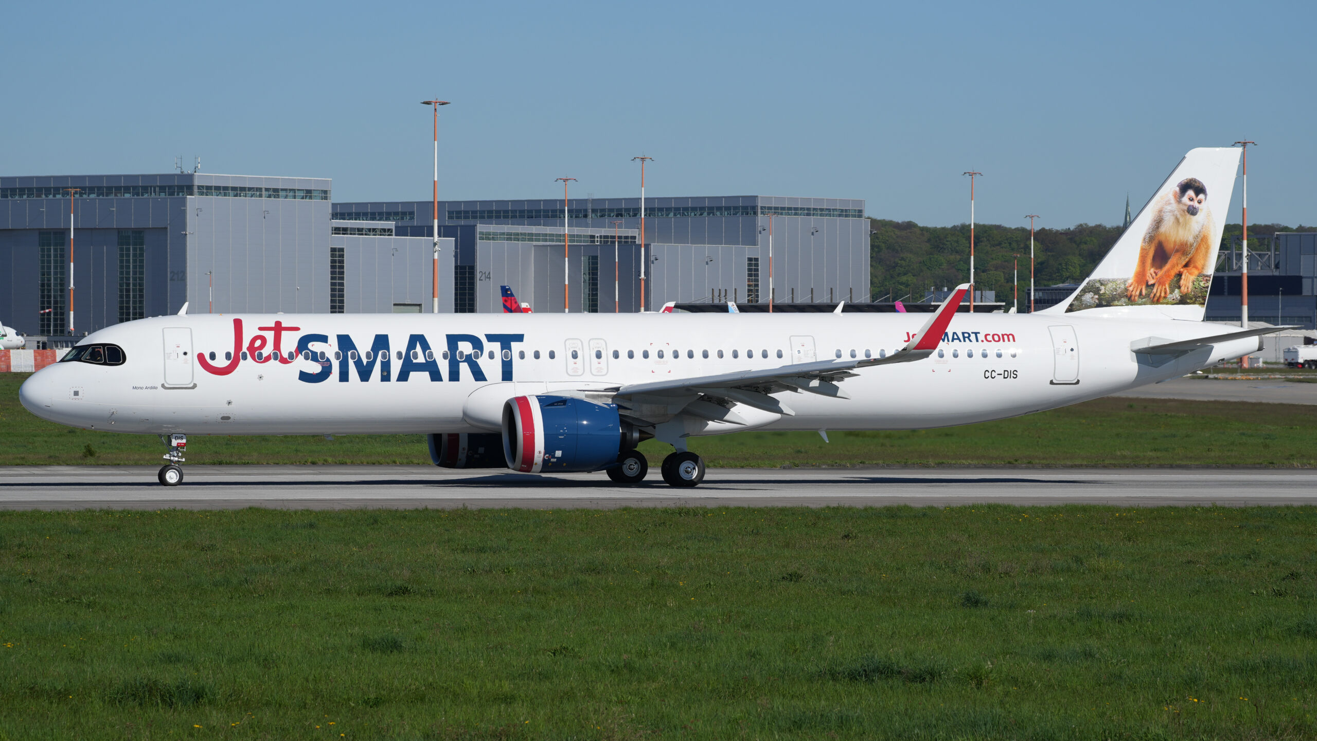 a white airplane on a runway