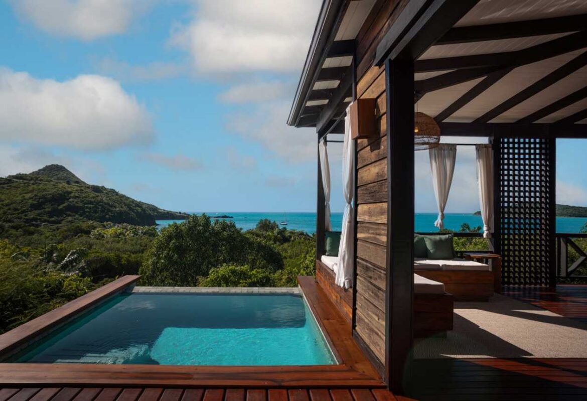 a pool in a house with a view of the ocean