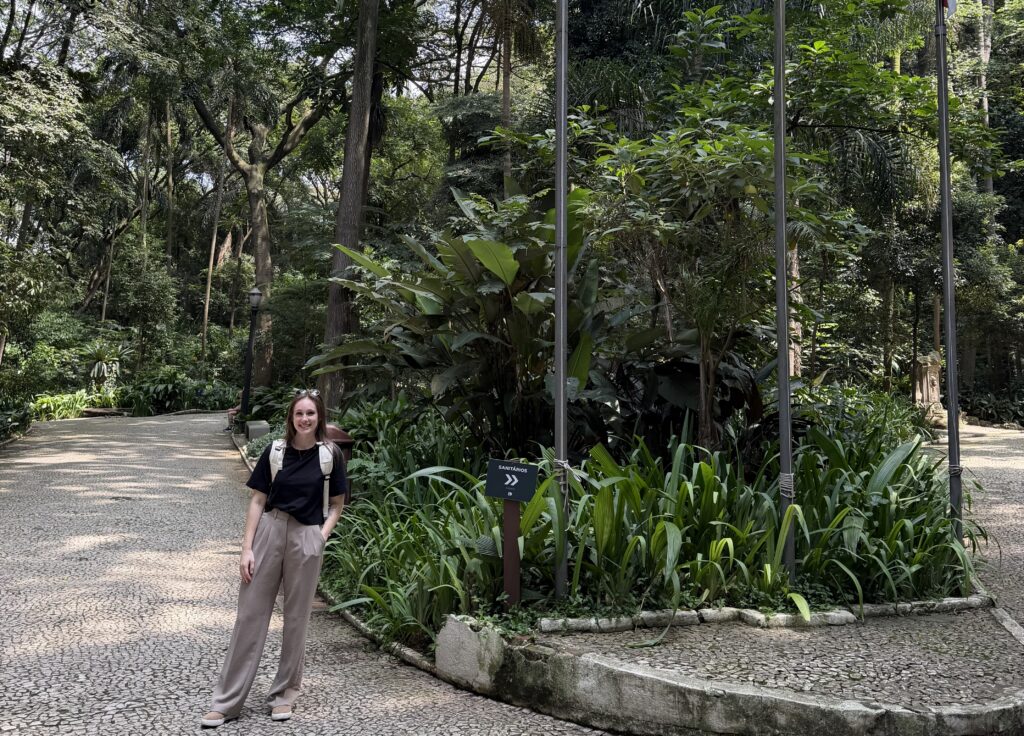 What to Know about Cultural Greetings a woman standing on a path with trees and plants