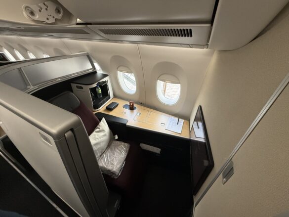 a table with a tv and a table in a plane