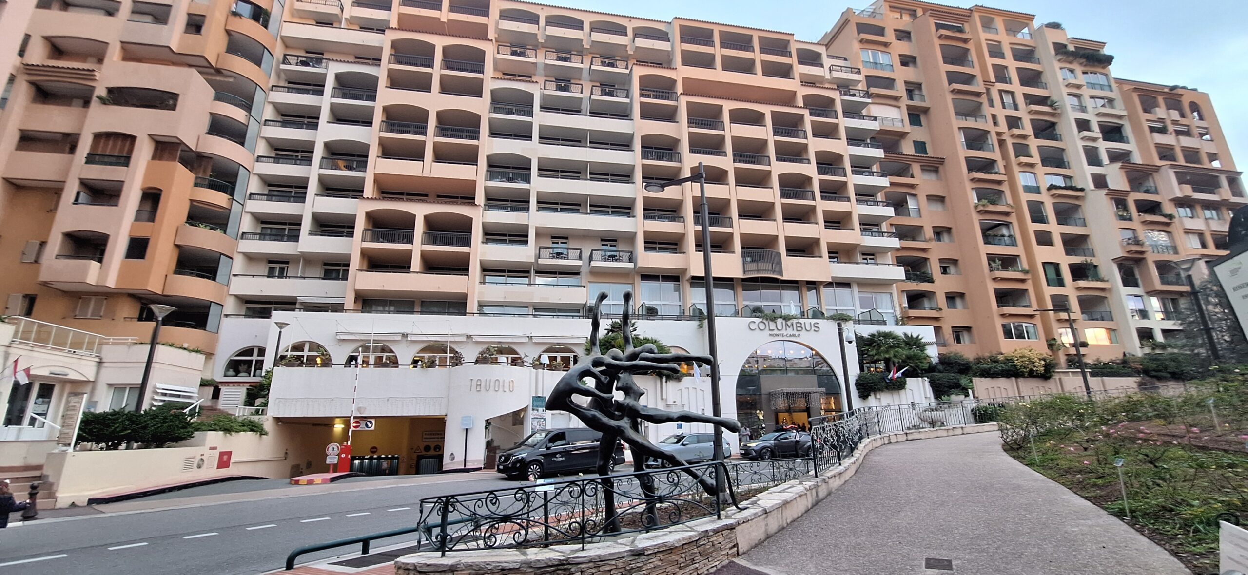 a statue in front of a building