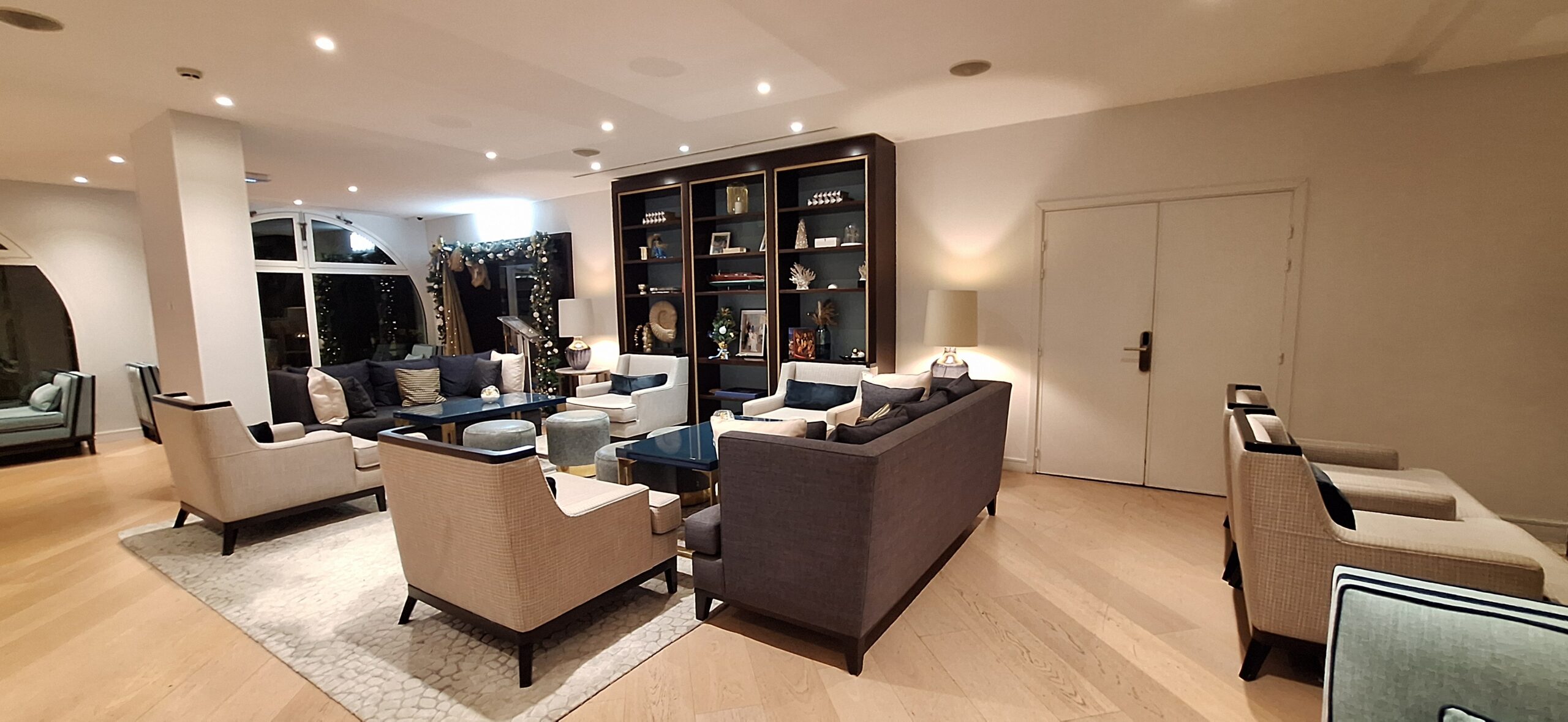 a room with couches and a bookcase