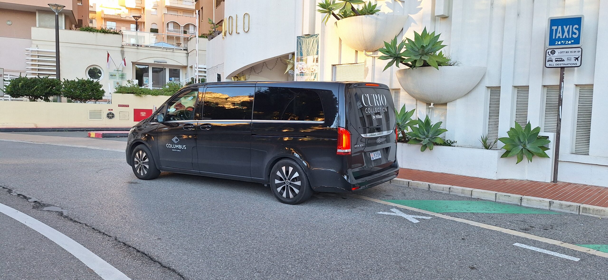 a black van parked in front of a building
