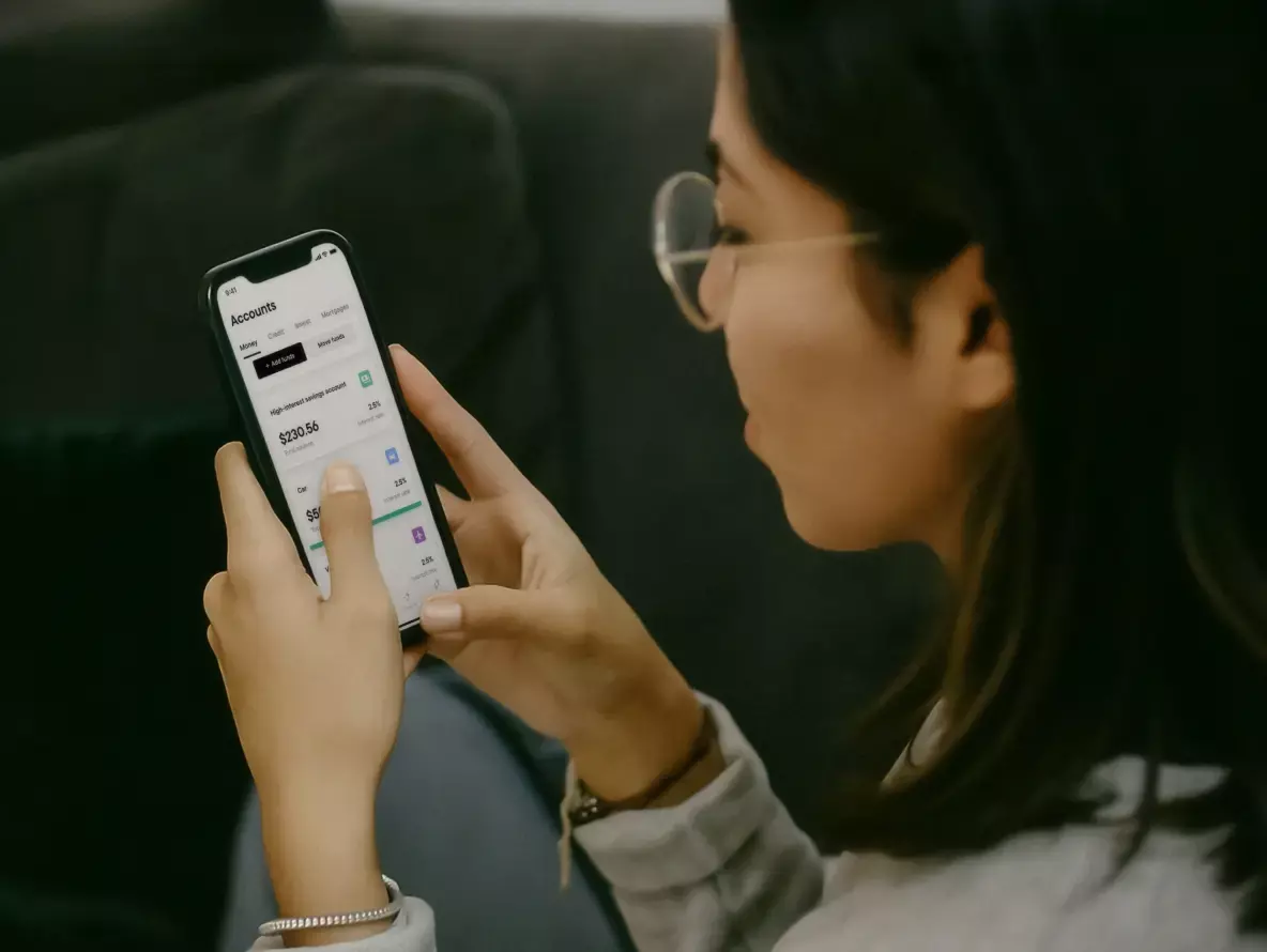 a woman holding a phone