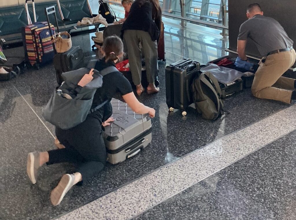a group of people with luggage