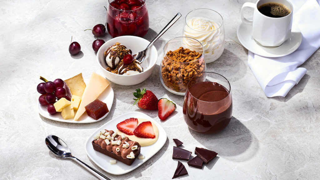 a table with desserts and drinks
