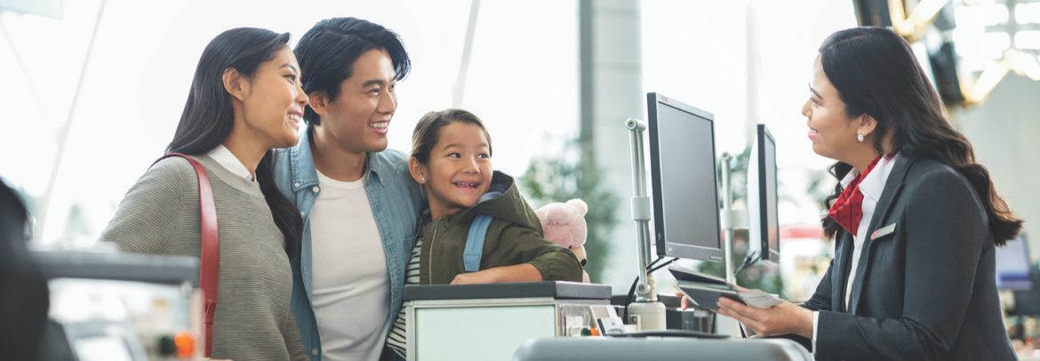 a man and a child looking at a computer screen