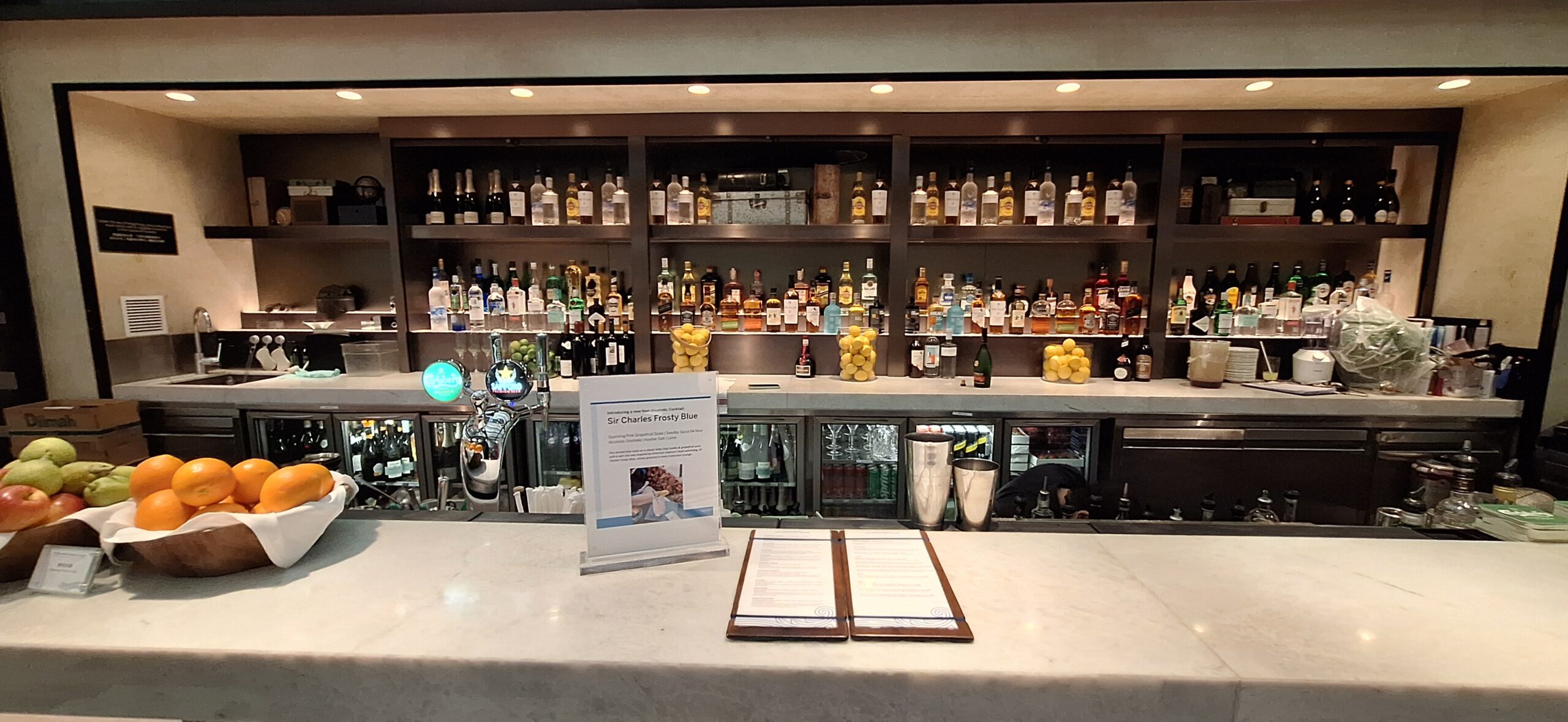 Centurion Lounge Hong Kong a bar with bottles of alcohol