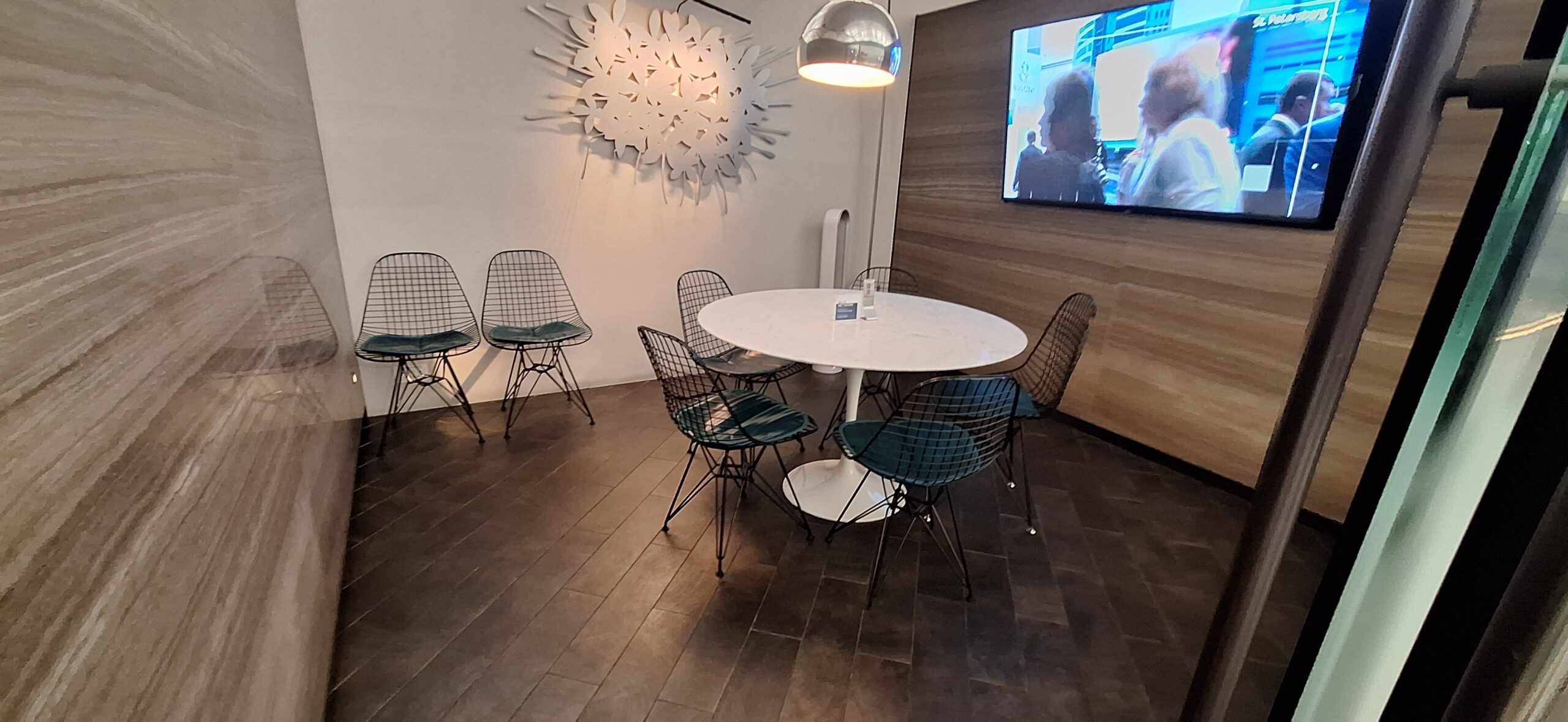 Centurion Lounge Hong Kong a table and chairs in a room