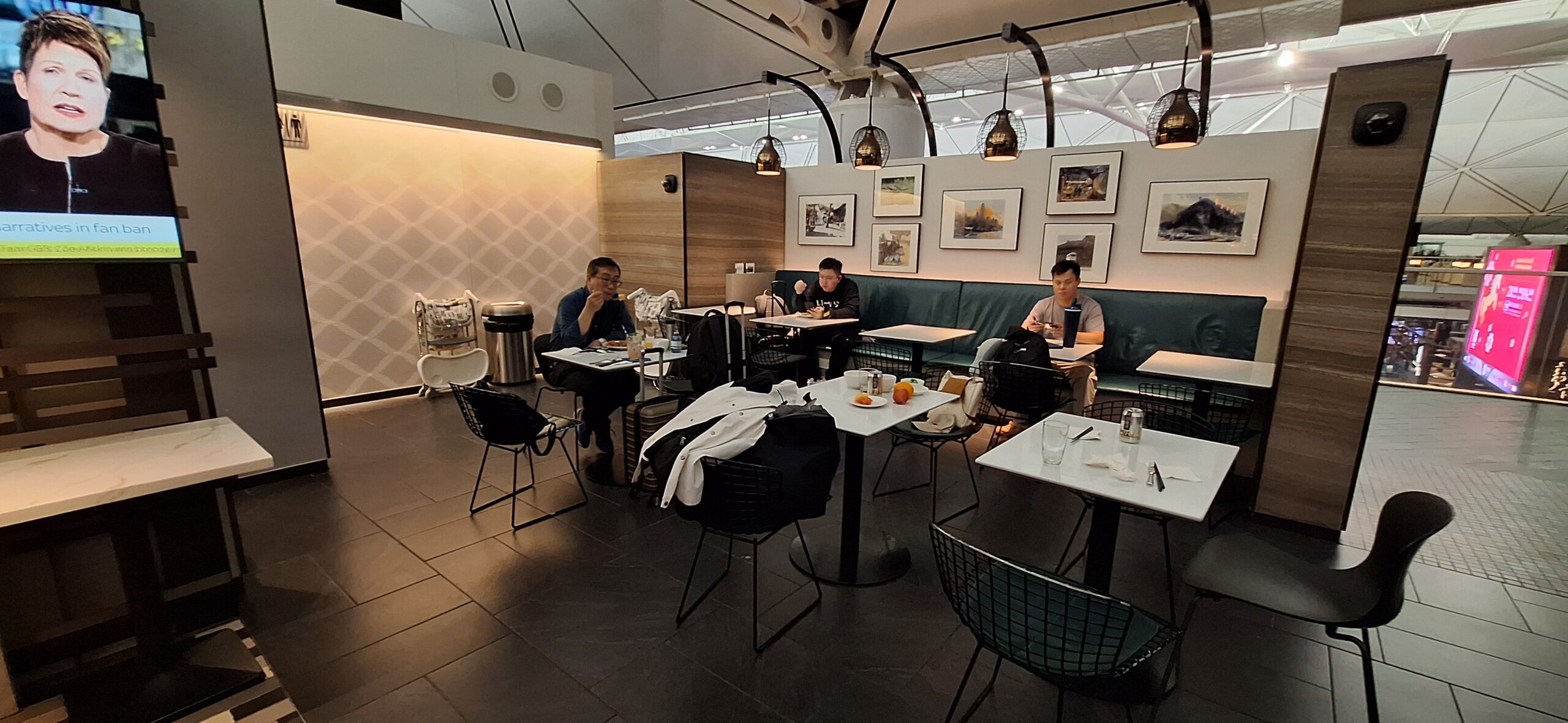 Centurion Lounge Hong Kong people sitting at tables in a restaurant