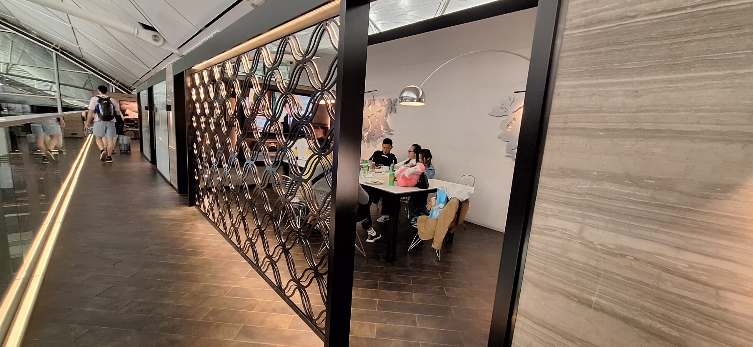 Centurion Lounge Hong Kong a group of people sitting at a table