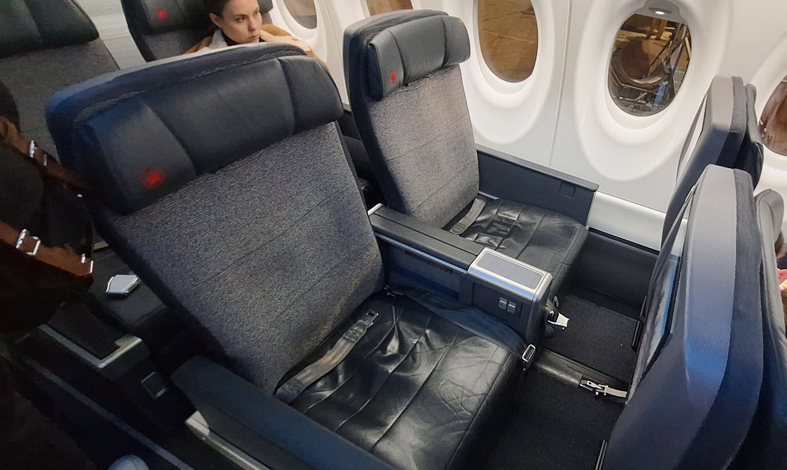 EVA Air Business Class a woman sitting in a plane