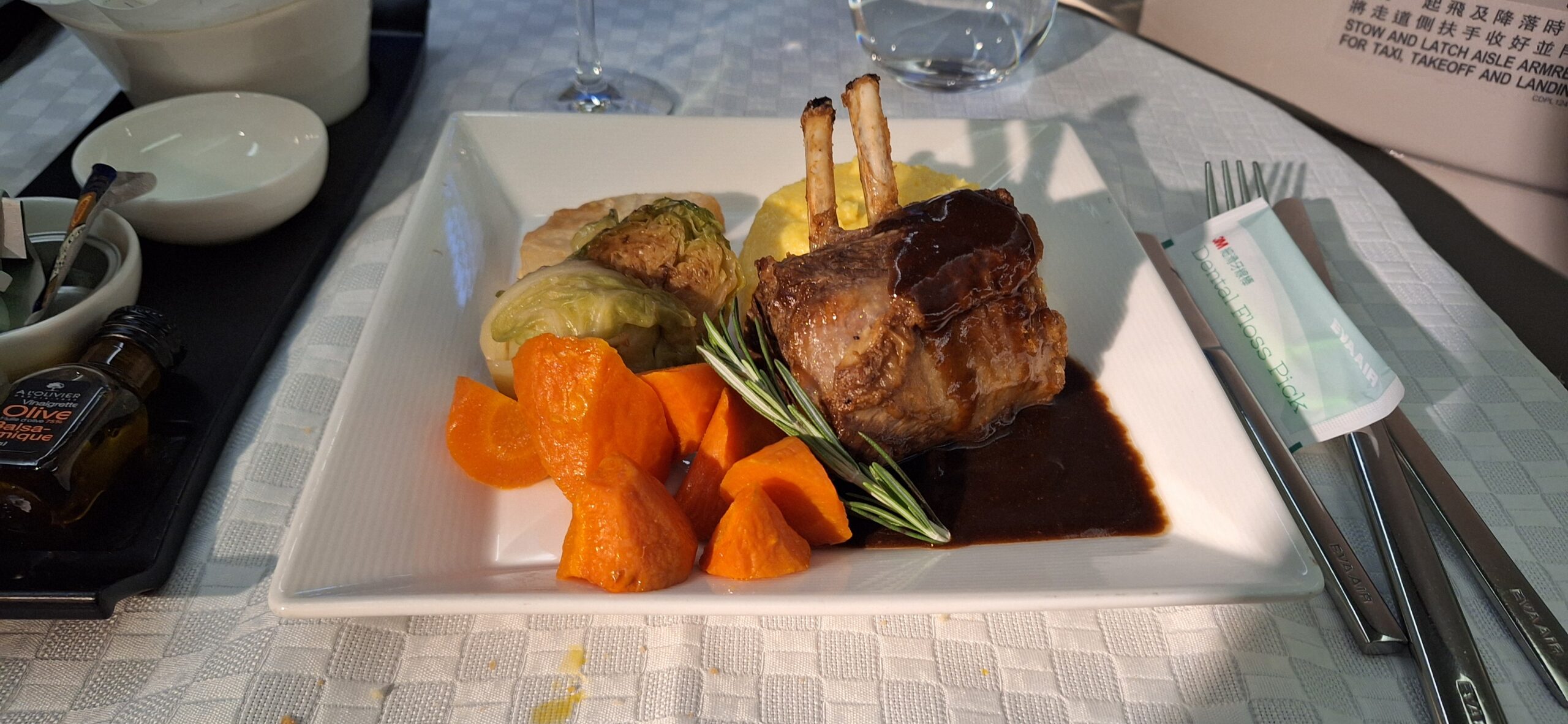 EVA Air Business Class a plate of food on a table